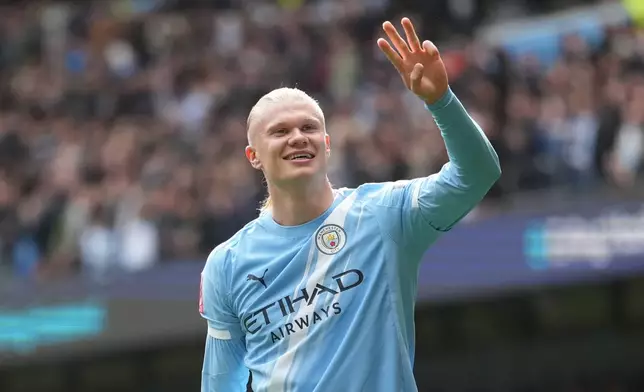 Manchester City's Erling Haaland celebrates after scoring his third goal during the FA Cup quarter-final soccer match between Manchester City and Liverpool in Manchester, England, Saturday, April 4, 2026. (AP Photo/Jon Super)