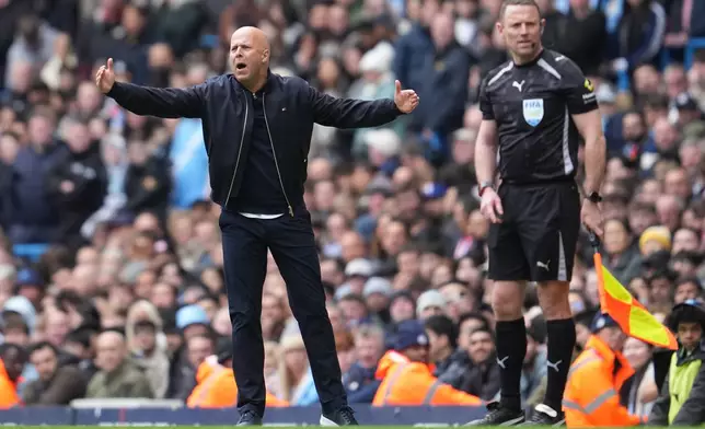 Liverpool's manager Arne Slot reacts during the FA Cup quarter-final soccer match between Manchester City and Liverpool in Manchester, England, Saturday, April 4, 2026. (AP Photo/Jon Super)