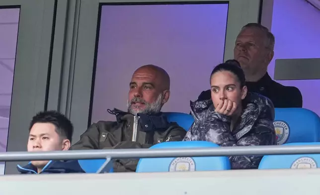 Manchester City's head coach Pep Guardiola watchs from the stand during the FA Cup quarter-final soccer match between Manchester City and Liverpool in Manchester, England, Saturday, April 4, 2026. (AP Photo/Jon Super)
