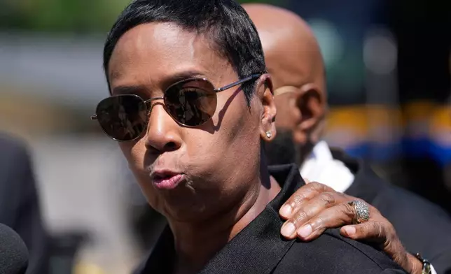 Council woman Tabatha Taylor arrives on the scene of a mass shooting in Shreveport, La., Sunday, April 19, 2026. (AP Photo/Gerald Herbert)