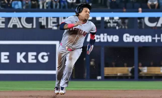 Cleveland Guardians' Jose Ramirez runs to third base during first-inning baseball game action against the Toronto Blue Jays in Toronto, Friday, April 24, 2026. (Jon Blacker/The Canadian Press via AP)