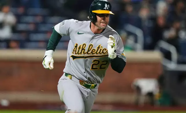 Athletics' Jeff McNeil (22) runs to first base for an RBI single during the ninth inning of a baseball game against the New York Mets Friday, April 10, 2026, in New York. (AP Photo/Frank Franklin II)