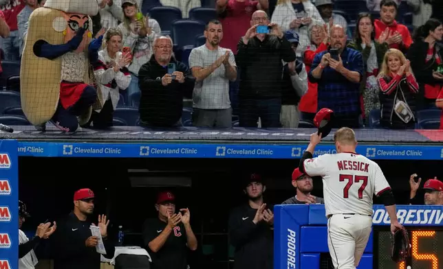 Cleveland Guardians pitcher Parker Messick (77) tips his hat to the crowd as he is taken out of the game in the nintgh inning of a baseball game against the Baltimore Orioles in Cleveland, Thursday, April 16, 2026. (AP Photo/Sue Ogrocki)