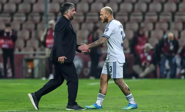 Italy coach Gennaro Gattuso greets Federico Dimarco during the World Cup qualifying playoff final soccer match between Bosnia and Italy in Zenica, Bosnia, Tuesday, March 31, 2026. (AP Photo/Armin Durgut)