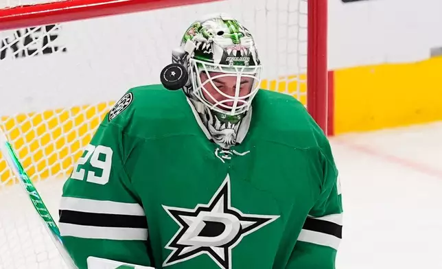 Dallas Stars goaltender Jake Oettinger blocks a shot from the Winnipeg Jets in the second period of an NHL hockey game Thursday, April 2, 2026, in Dallas. (AP Photo/Tony Gutierrez)