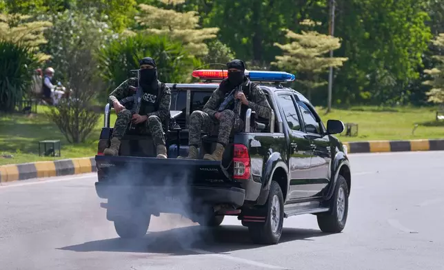Paramilitary soldiers patrol to ensure security ahead of the second round of talk between the U.S. and Iran, in Islamabad, Pakistan, Tuesday, April 21, 2026. (AP Photo/Anjum Naveed)