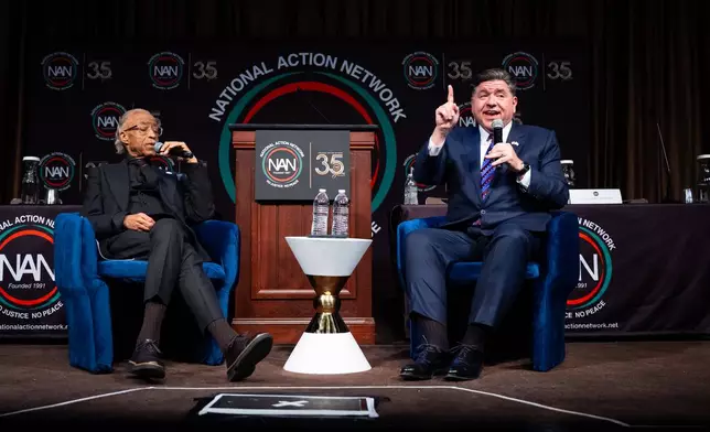 Illinois Gov. J.B. Pritzker speaks at the National Action Network Convention, accompanied by the Rev. Al Sharpton, in New York, Thursday, April 9, 2026. (AP Photo/Angelina Katsanis)