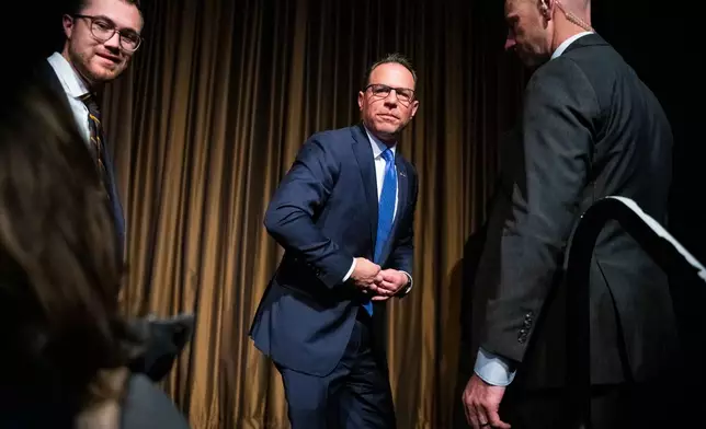 Josh Shapiro, Governor of Pennsylvania, exits the stage of the National Action Network (NAN) Convention in New York, Wednesday, April 8, 2026. (AP Photo/Angelina Katsanis)