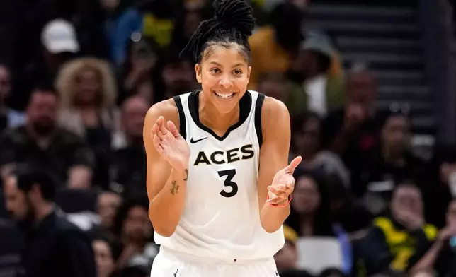 FILE - Former Las Vegas Aces forward Candace Parker reacts during the first half of a WNBA basketball game against the Seattle Storm, May 20, 2023, in Seattle. (AP Photo/Lindsey Wasson, File)
