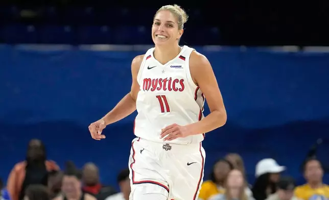 FILE - Washington Mystics' Elena Delle Donne smiles after scoring during a WNBA basketball game against the Chicago Sky Thursday, June 22, 2023, in Chicago. (AP Photo/Charles Rex Arbogast, File)