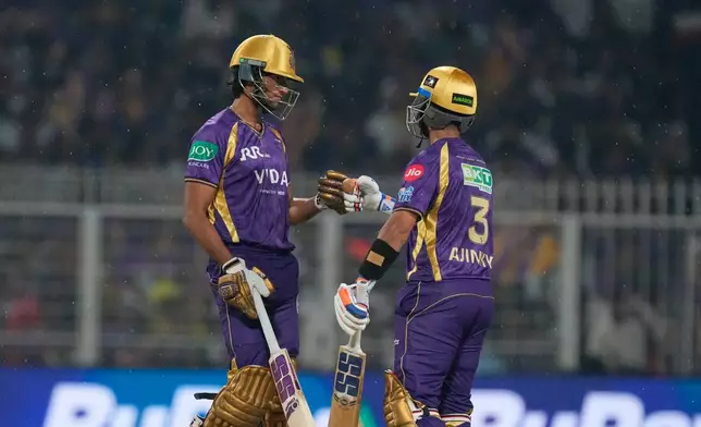 Kolkata Knight Riders' captain Ajinkya Rahane, right, and Akash Deep bump fists during the Indian Premier League cricket match between Kolkata Knight Riders and Punjab Kings in Kolkata , India, Monday, April 6, 2026. (AP Photo/Bikas Das)