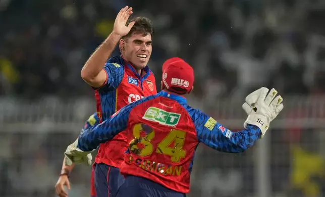 Punjab Kings' Xavier Bartlett celebrates the wicket of Kolkata Knight Riders' Cameron Green during the Indian Premier League cricket match between Kolkata Knight Riders and Punjab Kings in Kolkata , India, Monday, April 6, 2026. (AP Photo/Bikas Das)