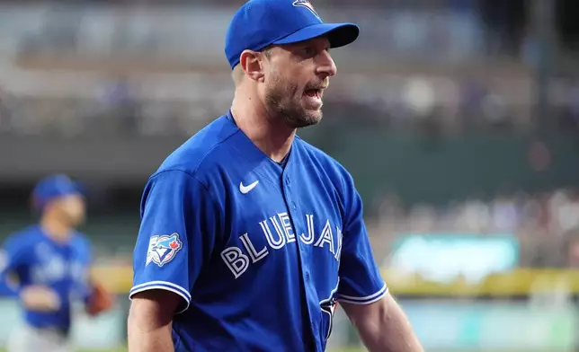 Toronto Blue Jays starting pitcher Max Scherzer shouts as he walks off the field during the sixth inning of a baseball game against the Arizona Diamondbacks, Saturday, April 18, 2026, in Phoenix. (AP Photo/Ross D. Franklin)