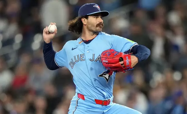 Toronto Blue Jays pitcher Dylan Cease (84) throws during the first inning of a baseball game Los Angeles Dodgers in Toronto, Wednesday, April 8, 2026. (Nathan Denette/The Canadian Press via AP)