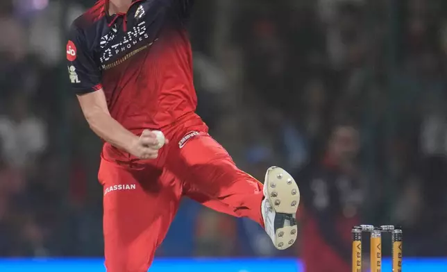 Royal Challengers Bengaluru's Josh Hazlewood bowls a delivery during the Indian Premier League cricket match between Delhi Capitals and Royal Challengers Bengaluru in Delhi, India, Monday, April 27, 2026. (AP Photo/Manish Swarup)