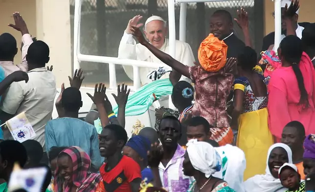 FILE - Pope Francis waves to the crowd on the occasion of his visit at the Central Mosque in Bangui's Muslim enclave of PK5, Central African Republic, on Nov. 30, 2015. (AP Photo/Jerome Delay, File)