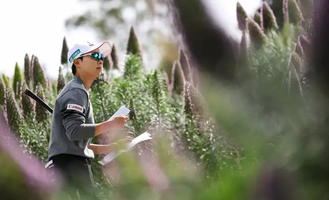 Hyo Joo Kim walks on a pathway to the third tee during the first round of the LPGA's JM Eagle LA Championship golf tournament at El Caballero Country Club, Thursday, April 16, 2026, in Los Angeles. (AP Photo/Jessie Alcheh)