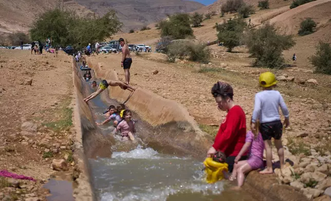 Israelis enjoy a day at a spring in Auja, in the Jordan Valley, during Israel's Independence Day on Wednesday, April 22, 2026, in the occupied West Bank. (AP Photo/Ohad Zwigenberg)