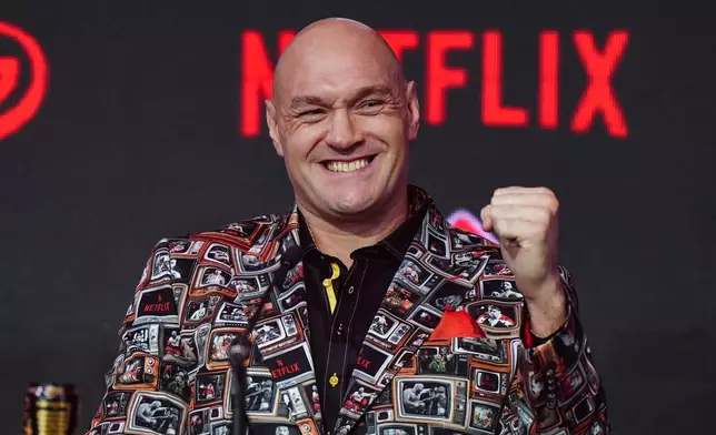 Boxer Tyson Fury reacts during a press conference, Thursday April 9, 2026, in London, for his upcoming fight against Arslanbek Makhmudov. (Bradley Collyer/PA via AP)
