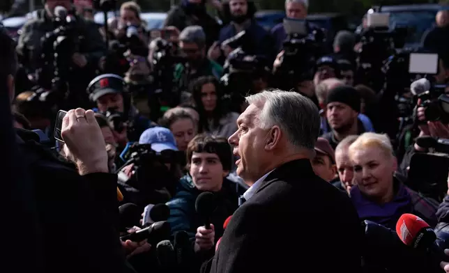 Hungary's Prime Minister Viktor Orban addresses the media outside a polling station after voting in Budapest, Hungary, Sunday, April 12, 2026. (AP Photo/Petr David Josek)