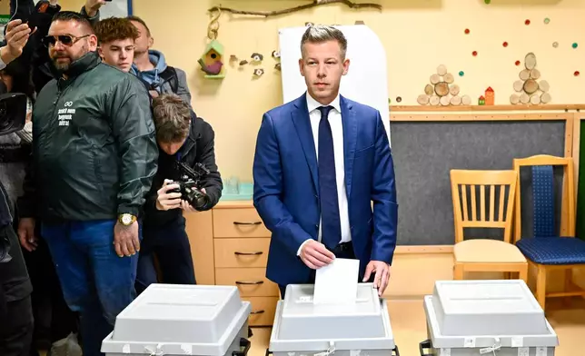 Peter Magyar, leader of the opposition Tisza party, casts his ballot at a polling station in Budapest, Hungary, Sunday, April 12, 2026. (AP Photo/Denes Erdos)
