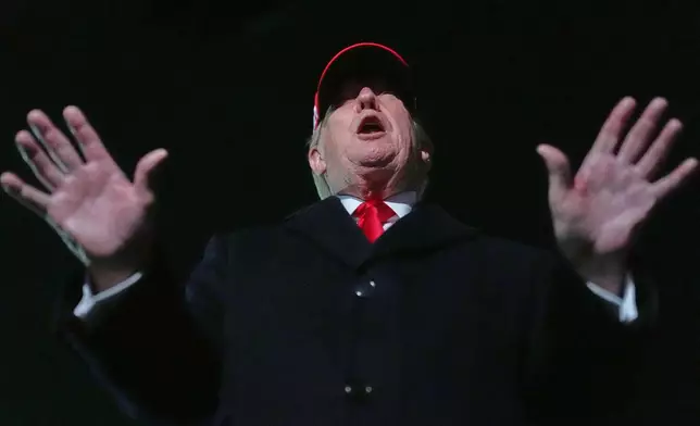 President Donald Trump speaks with reporters at Joint Base Andrews, Md., Sunday, April 12, 2026, after he returned from Miami. (AP Photo/Julia Demaree Nikhinson)