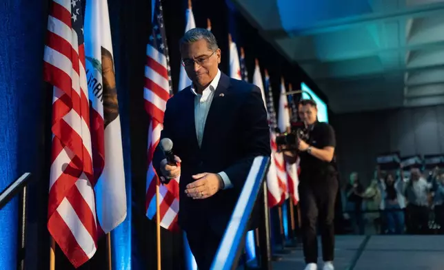 California gubernatorial candidate Xavier Becerra walks down the steps after speaking at a campaign event in Los Angeles, Saturday, April 18, 2026. (AP Photo/Jae C. Hong)