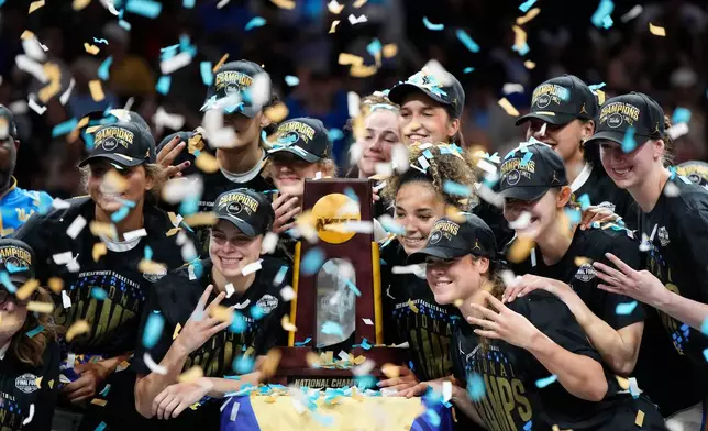 UCLA players celebrate after defeating South Carolina in the women's National Championship Final Four NCAA college basketball tournament game, Sunday, April 5, 2026, in Phoenix. (AP Photo/Ross D. Franklin)