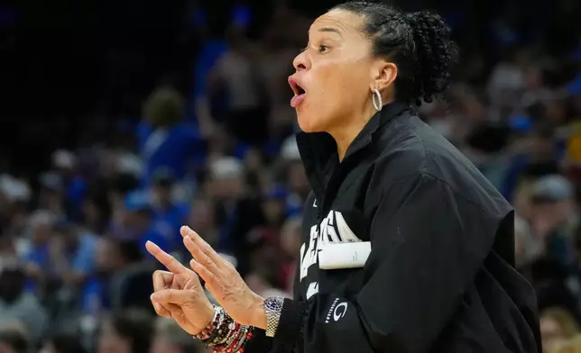 South Carolina head coach Dawn Staley motions towards the court against UCLA during the second half of the women's National Championship Final Four NCAA college basketball tournament game, Sunday, April 5, 2026, in Phoenix. (AP Photo/Ross D. Franklin)