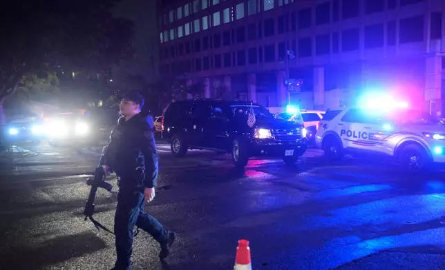 Law enforcement are seen outside the White House Correspondents Dinner, Saturday, April 25, 2026, in Washington. (AP Photo/Rod Lamkey, Jr.)