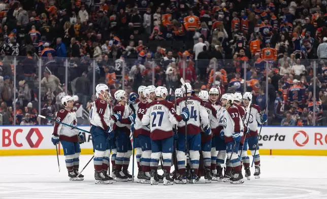 Colorado Avalanche celebrate the win over the Edmonton Oilers during shoot-out NHL action, in Edmonton on Monday, April 13, 2026. (Jason Franson/The Canadian Press via AP)