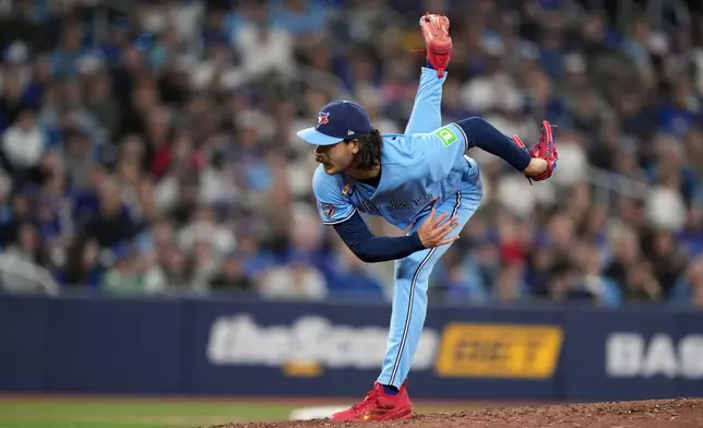 Toronto Blue Jays pitcher Dylan Cease (84) pitches during sixth inning of a baseball game against the Los Angeles Dodgers in Toronto, Wednesday, April 8, 2026. (Nathan Denette/The Canadian Press via AP)