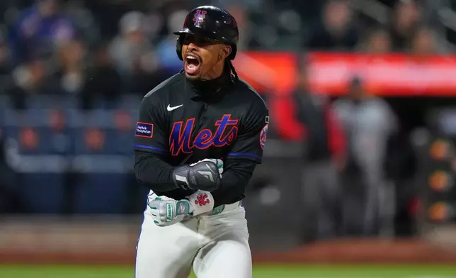 New York Mets' Francisco Lindor celebrates after hitting a three-run home run during the third inning of a baseball game against the Minnesota Twins Tuesday, April 21, 2026, in New York. (AP Photo/Frank Franklin II)