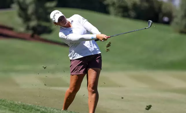 Lauren Coughlin hits an approach shot on the fourth hole during the final round of the Aramco Championship golf tournament Sunday, April 5, 2026, in North Las Vegas, Nev. (AP Photo/Ian Maule)