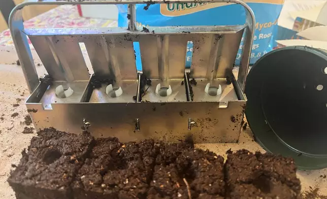 Freshly made soil blocks and a 4-cell, hand-held soil blocker are displayed on Long Island, N. Y., on April 10, 2026. (Jessica Damiano via AP)