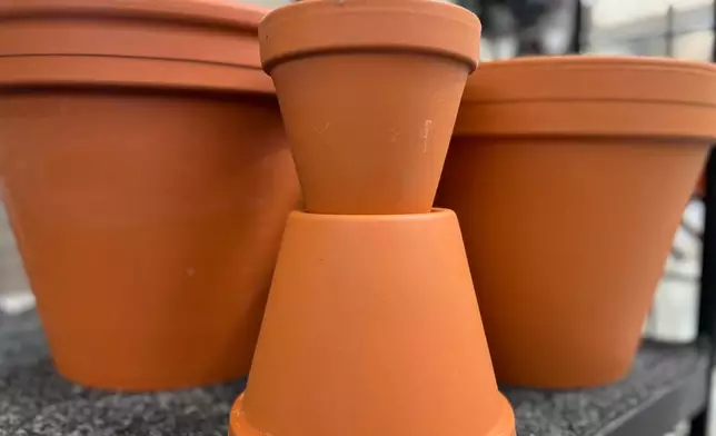 An assortment of plastic-free terracotta planting pots are displayed on Long Island, N. Y., on April 8, 2026. (Jessica Damiano via AP)