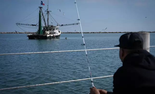 A fishing boat works just offshore in the Corpus Christi Bay on Thursday, Nov. 16, 2023, in Corpus Christi, Texas. (Jon Shapley/Houston Chronicle via AP)