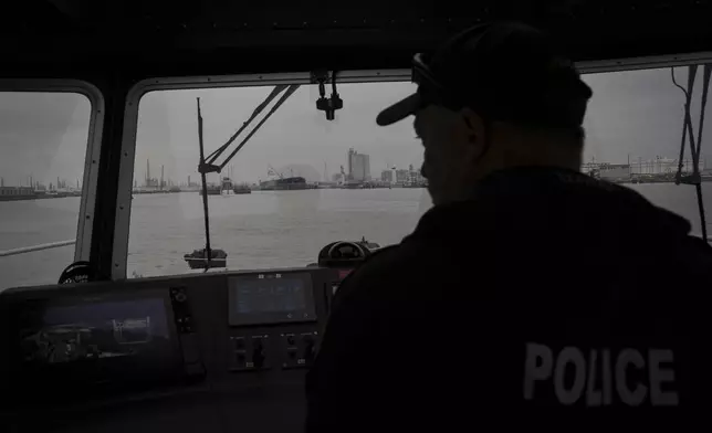 A Port of Corpus Christi police officer guides a boat through the port Thursday, Nov. 16, 2023, in Corpus Christi, Texas. (Jon Shapley/Houston Chronicle via AP)