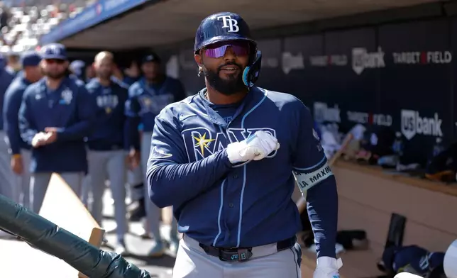Tampa Bay Rays' Junior Caminero celebrates in the dugout after hitting a solo home run during the fourth inning of a baseball game against the Minnesota Twins, Sunday, April 5, 2026, in Minneapolis. (AP Photo/Bailey Hillesheim)
