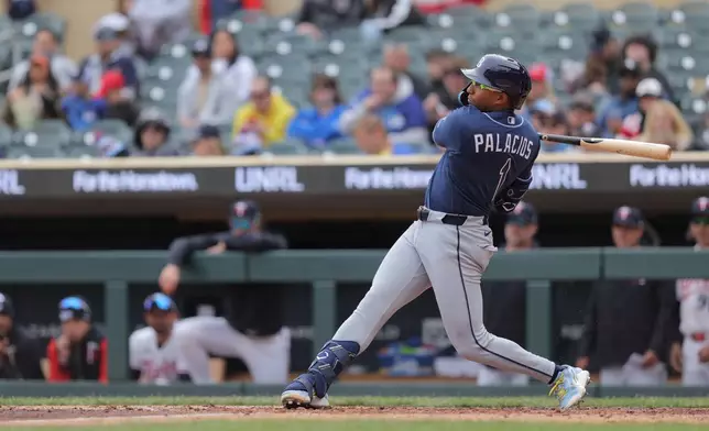 Tampa Bay Rays second baseman Richie Palacios (1) hits a single during the seventh inning of a baseball game against the Minnesota Twins, Sunday, April 5, 2026, in Minneapolis. (AP Photo/Bailey Hillesheim)