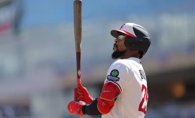 Minnesota Twins designated hitter Byron Buxton (25) looks on before an at-bat during the first inning of a baseball game against the Tampa Bay Rays, Sunday, April 5, 2026, in Minneapolis. (AP Photo/Bailey Hillesheim)