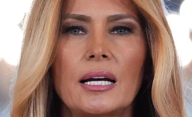 First lady Melania Trump speaks to reporters Thursday, April 9, 2026, in the Grand Foyer of the White House in Washington. (AP Photo/Jacquelyn Martin)
