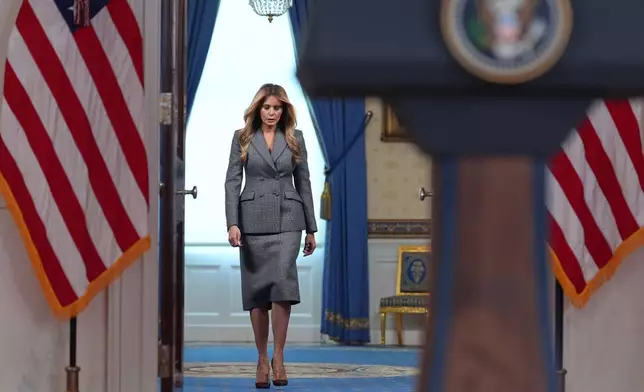 First lady Melania Trump arrives to speak with reporters Thursday, April 9, 2026, in the Grand Foyer of the White House in Washington. (AP Photo/Jacquelyn Martin)