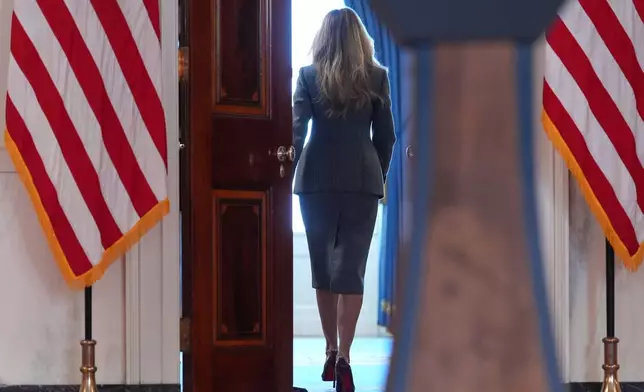 First lady Melania Trump departs after speaking with reporters Thursday, April 9, 2026, in the Grand Foyer of the White House in Washington. (AP Photo/Jacquelyn Martin)