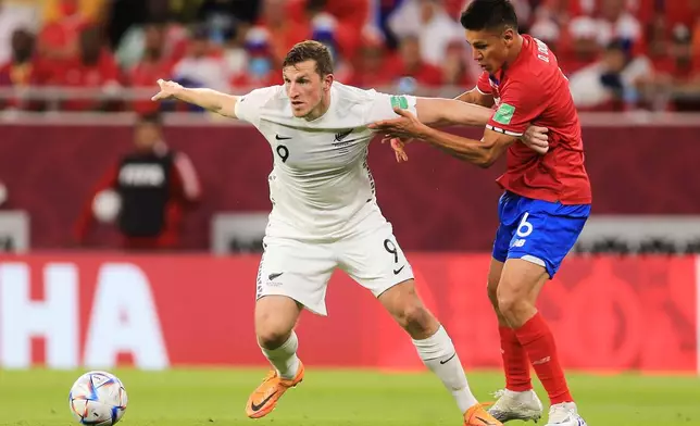 FILE - New Zealand's Chris Wood, left, and Costa Rica's Oscar Duarte fightduring the World Cup 2022 qualifying play-off soccer match between New Zealand and Costa Rica in Al Rayyan, Qatar, Tuesday, June 14, 2022. (AP Photo/Hussein Sayed, File)