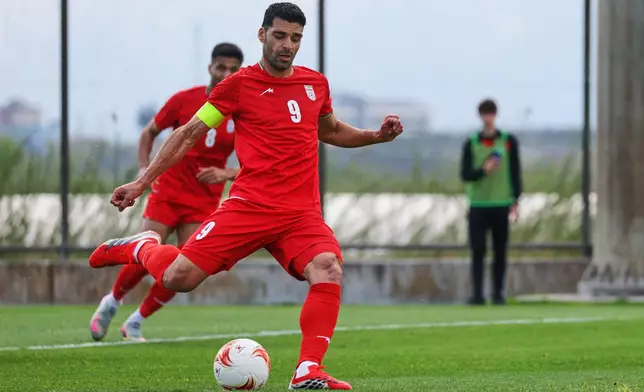 FILE - Iran's Mehdi Taremi shoots a penalty kick to score his side's second goal during a friendly soccer match between Iran and Costa Rica, in Antalya, southern Turkey, Tuesday, March 31, 2026. (AP Photo/Riza Ozel, File)