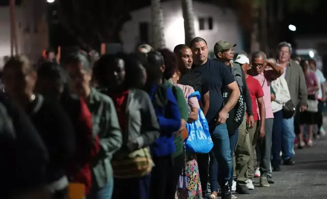 Corpus Christi Catholic Church members participate in a rehearsal for their Good Friday procession Monday, March 23, 2026, in Miami, Fla. (AP Photo/Marta Lavandier)