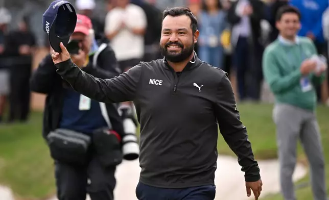 J.J. Spaun waves to fans after winning the Valero Texas Open golf tournament in San Antonio, Sunday, April 5, 2026. (AP Photo/Darren Abate)