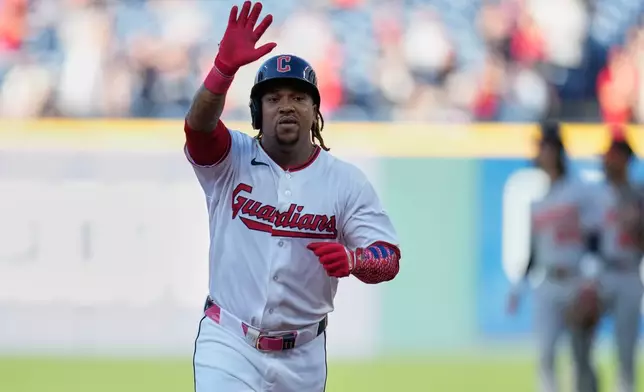 Cleveland Guardians' José Ramírez gestrures as he runs the bases after hitting a home run in the first inning of a baseball game against the Baltimore Orioles in Cleveland, Thursday, April 16, 2026. (AP Photo/Sue Ogrocki)