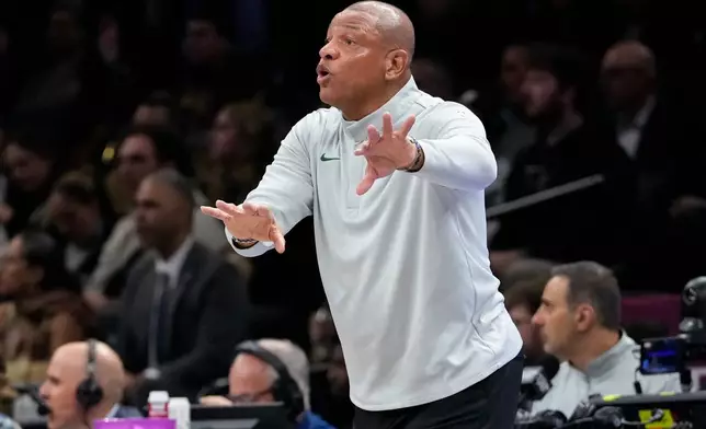 Milwaukee Bucks head coach Doc Rivers shouts during the first half of an NBA basketball game against Brooklyn Nets, Tuesday, April 7, 2026, in New York. (AP Photo/Yuki Iwamura)